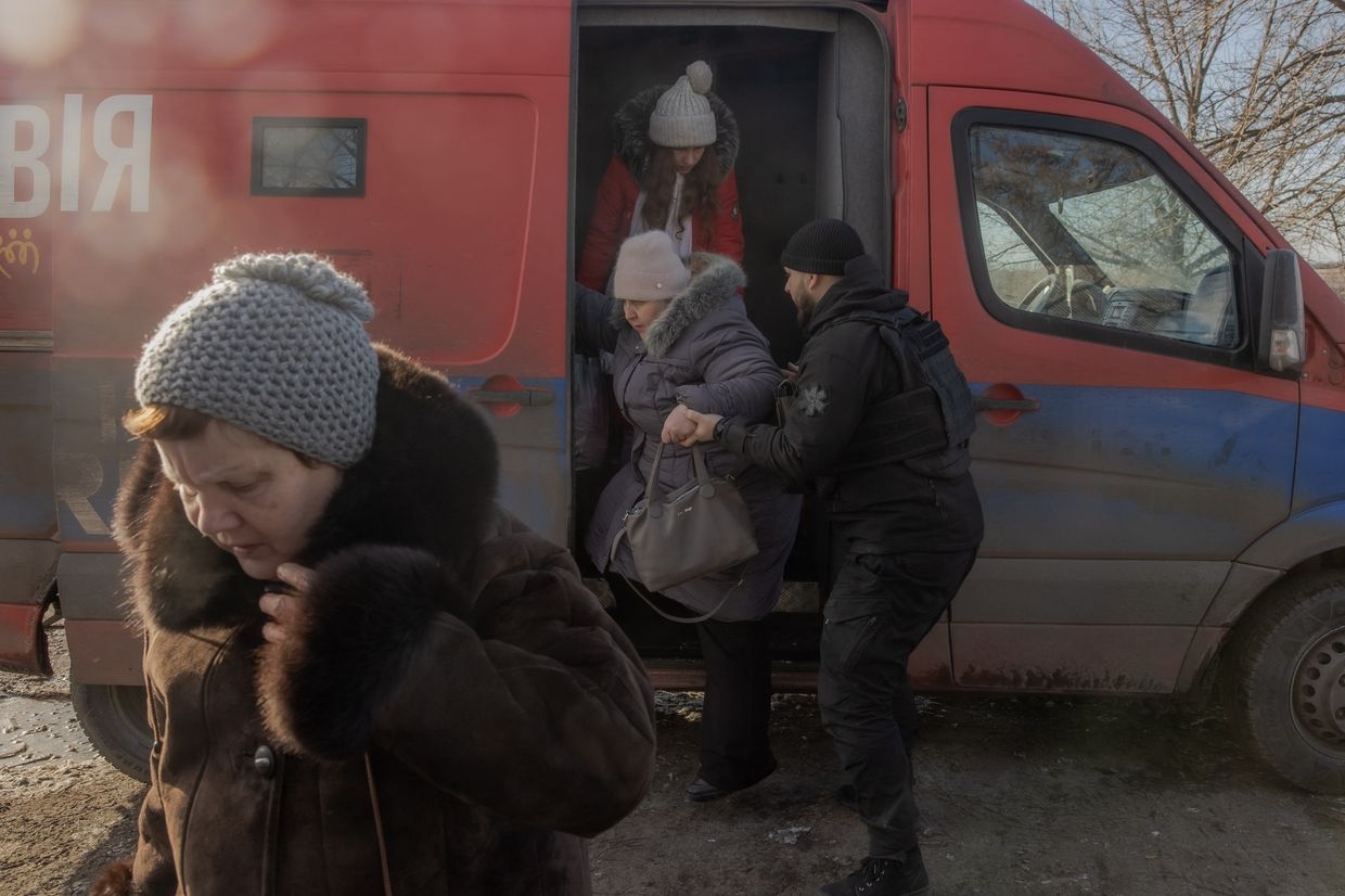 Evacuees from Pokrovsk arrive at an evacuation point outside the city, in the eastern Donetsk Oblast, on Dec. 14, 2024.