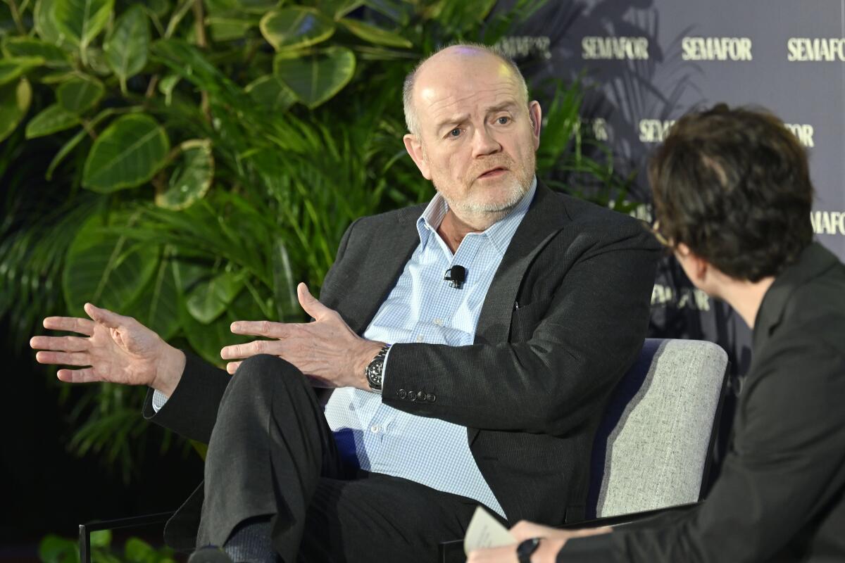 Chairman and CEO of CNN Worldwide Mark Thompson and media editor for Semafor, Maxwell Tani, speak onstage.