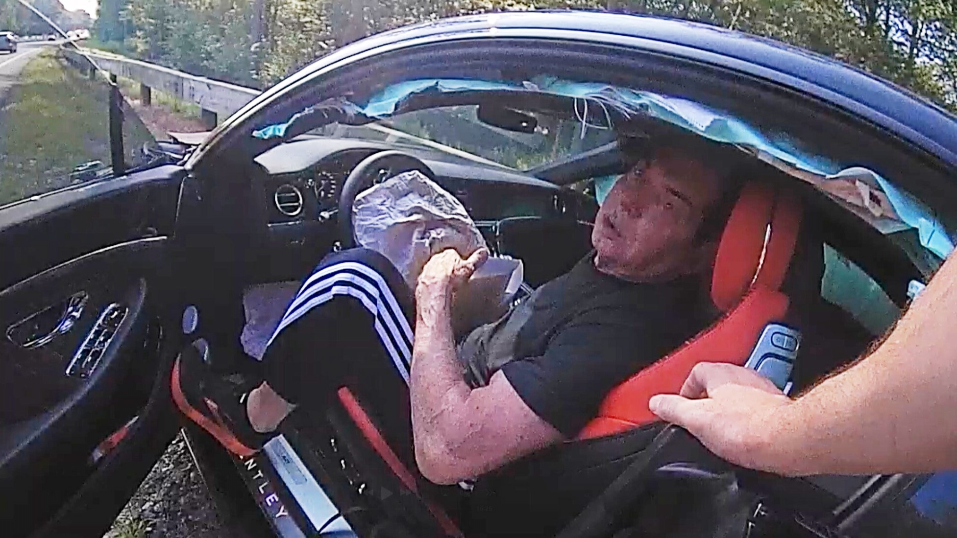 In an image taken from Connecticut State Police police bodycam video, Vince McMahon is questioned in his car after an accident on July 24, 2025, in Westport, Conn.