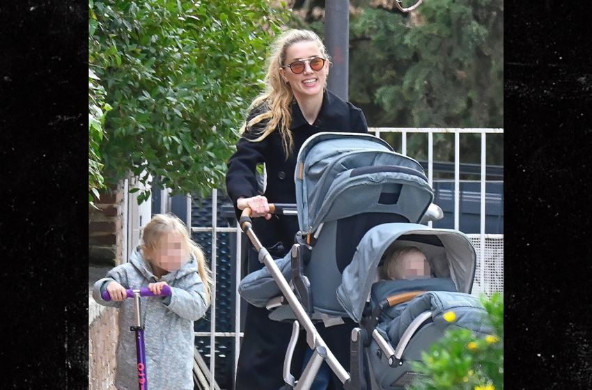  Amber Heard All Smiles as Johnny Depp Films Hollywood Return