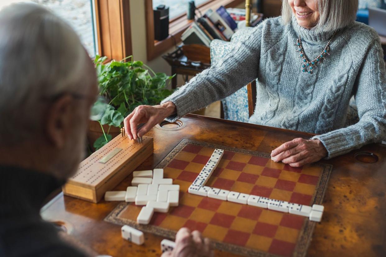 Stock image of elderly people playing a game. Getty