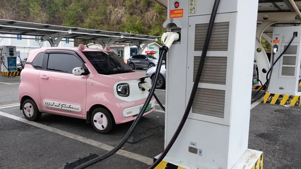 An electric vehicle charges at a charging station in Yichang, Hubei, China, on January 21, 2026. - NurPhoto/NurPhoto/NurPhoto via Getty Images