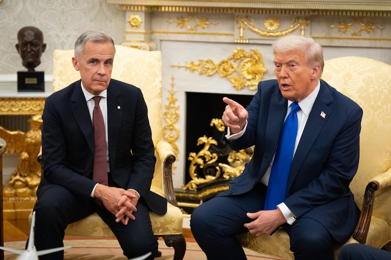 WASHINGTON,DC -   U.S. President Donald Trump met with Canadian Prime Minister Mark Carney in the Oval Office of the White House, Oct. 7, 2025, in Washington.(Photo by Sarah L. Voisin/The Washington Post via Getty Images)