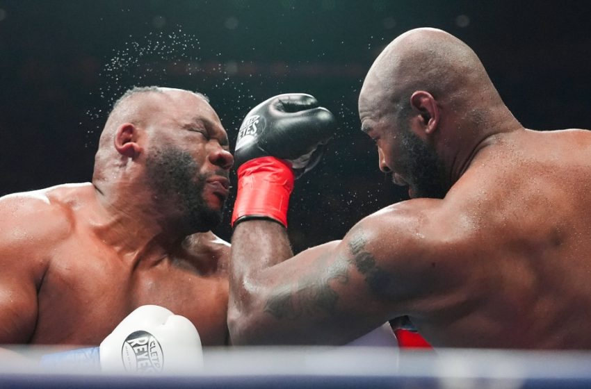  Boxer Jarrell Miller has hairpiece knocked upward by a punch, then throws it into the crowd