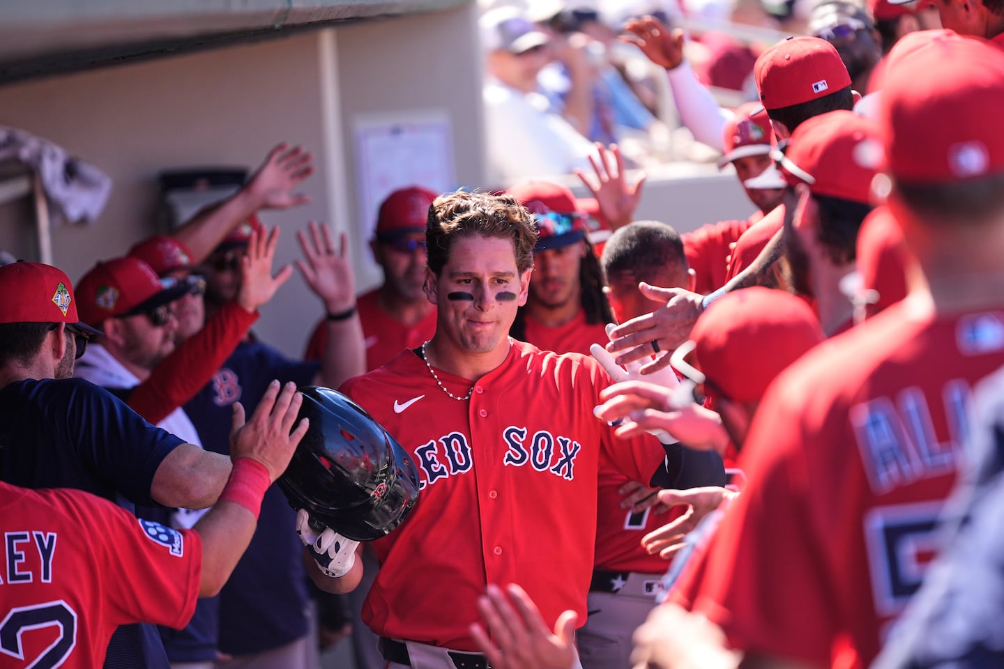 Roman Anthony is greeted in the Red Sox dugout after scoring in the fourth inning Wednesday.