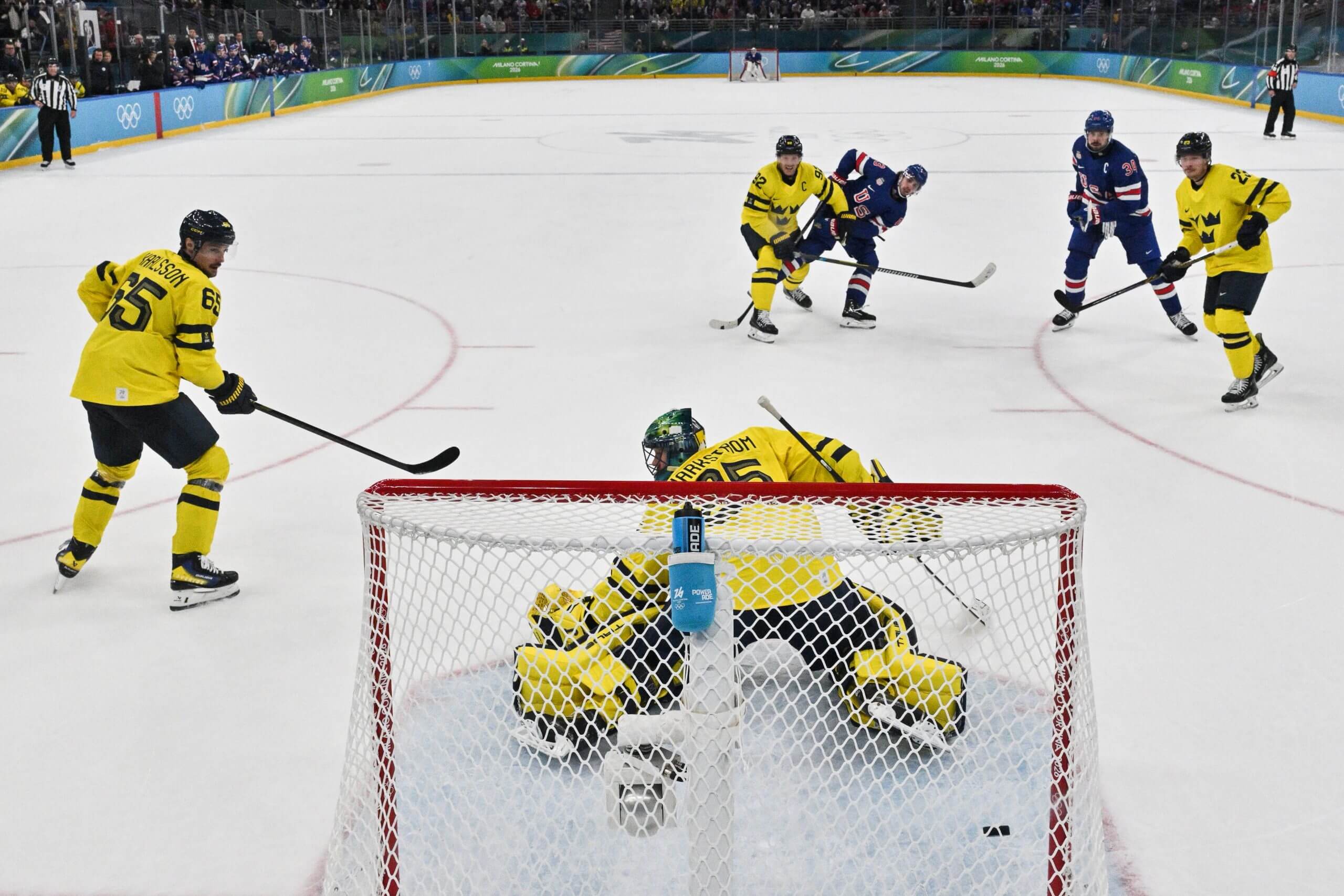 USA's Quinn Hughes shoots and scores his team's second goal to win the men's play-off quarter-final ice hockey match between USA and Sweden at the Milano Santagiulia Ice Hockey Arena during the Milano Cortina 2026 Winter Olympic Games in Milan, on February 18, 2026. 