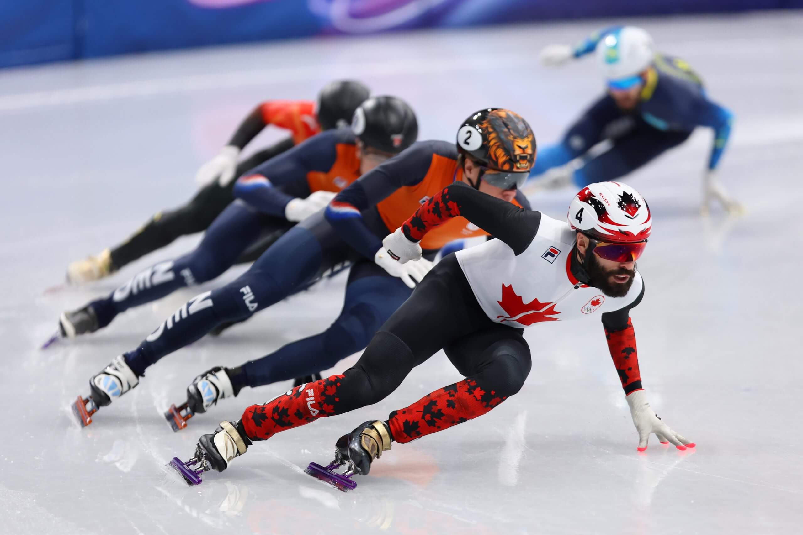 Steven Dubois of Team Canada leads during the semifinals of the Short Track Speed Skating Men's 500m on day twelve of the Milano Cortina 2026 Winter Olympic games at Milano Ice Skating Arena on February 18, 2026 in Milan, Italy. 