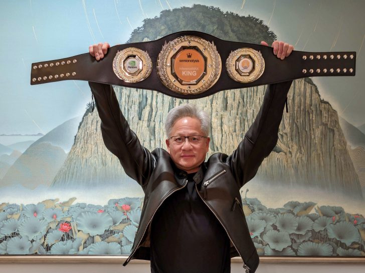 A person in a black leather jacket holding up a championship-style belt with visible 'NVIDIA' and 'semianalysis KING' logos.