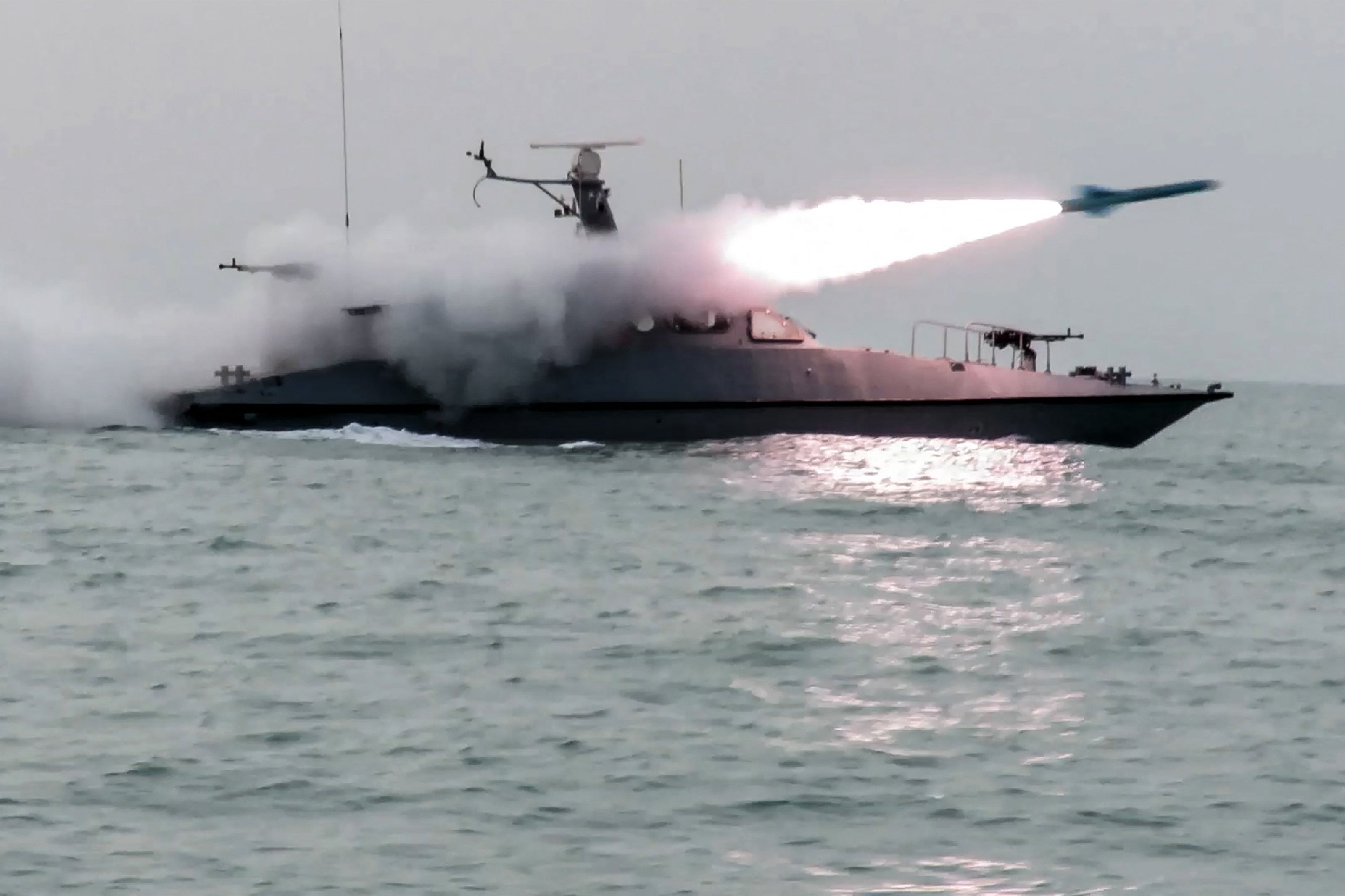 This handout photo released by Iran's Revolutionary Guards Corps (IRGC)'s official website Sepanews on February 16, 2026, shows a boat firing a missile during a military exercise by members of the IRGC and navy in the Gulf