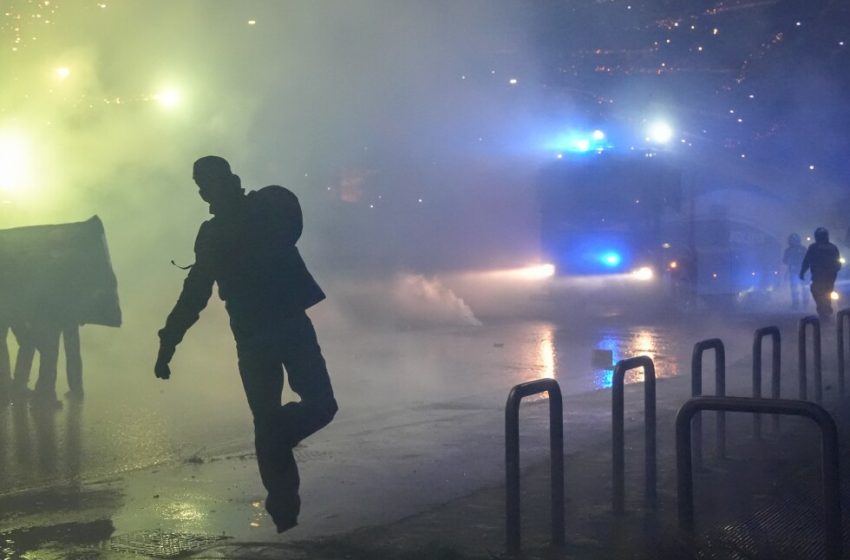  Italian police fire tear gas as protesters clash near Winter Olympics hockey venue