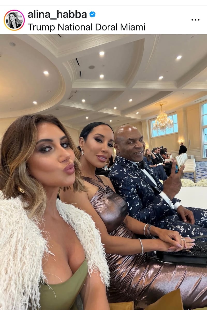 Alina Habba seated with Mike Tyson