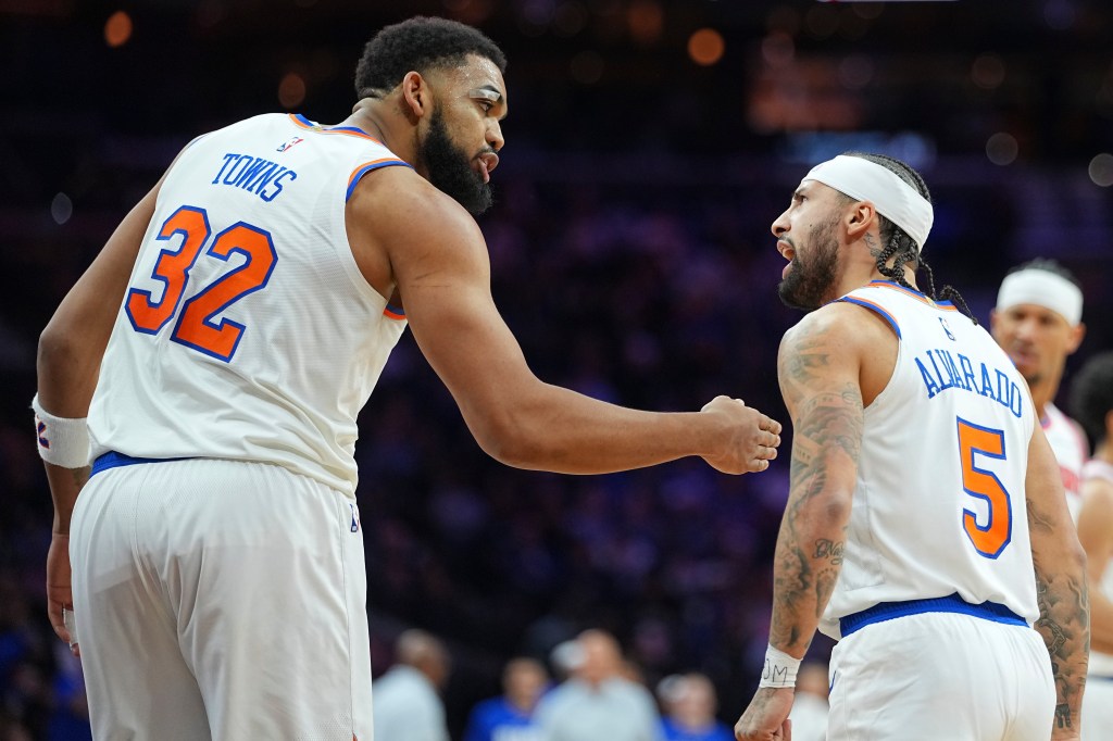 Jose Alvarado (right) celebrates with Karl-Anthony Towns during the Knicks' 138-89 blowout win over the 76ers on Feb. 11, 2026 in Philadelphia.