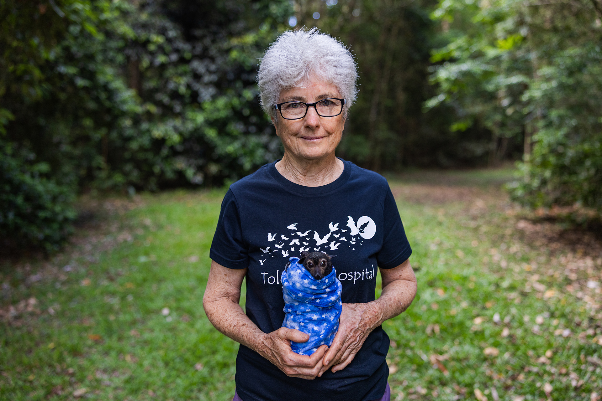 Jenny Mclean, Tolga Bat Hospital founder and director, holds an endangered spectacled flying fox.