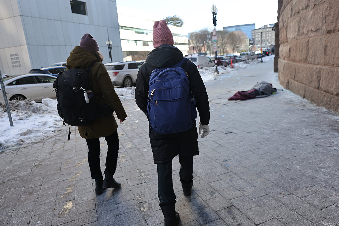 Amy Summer (left) and Dr. Katherine Koh approached a person in a sleeping bag on the sidewalk on Jan. 29.