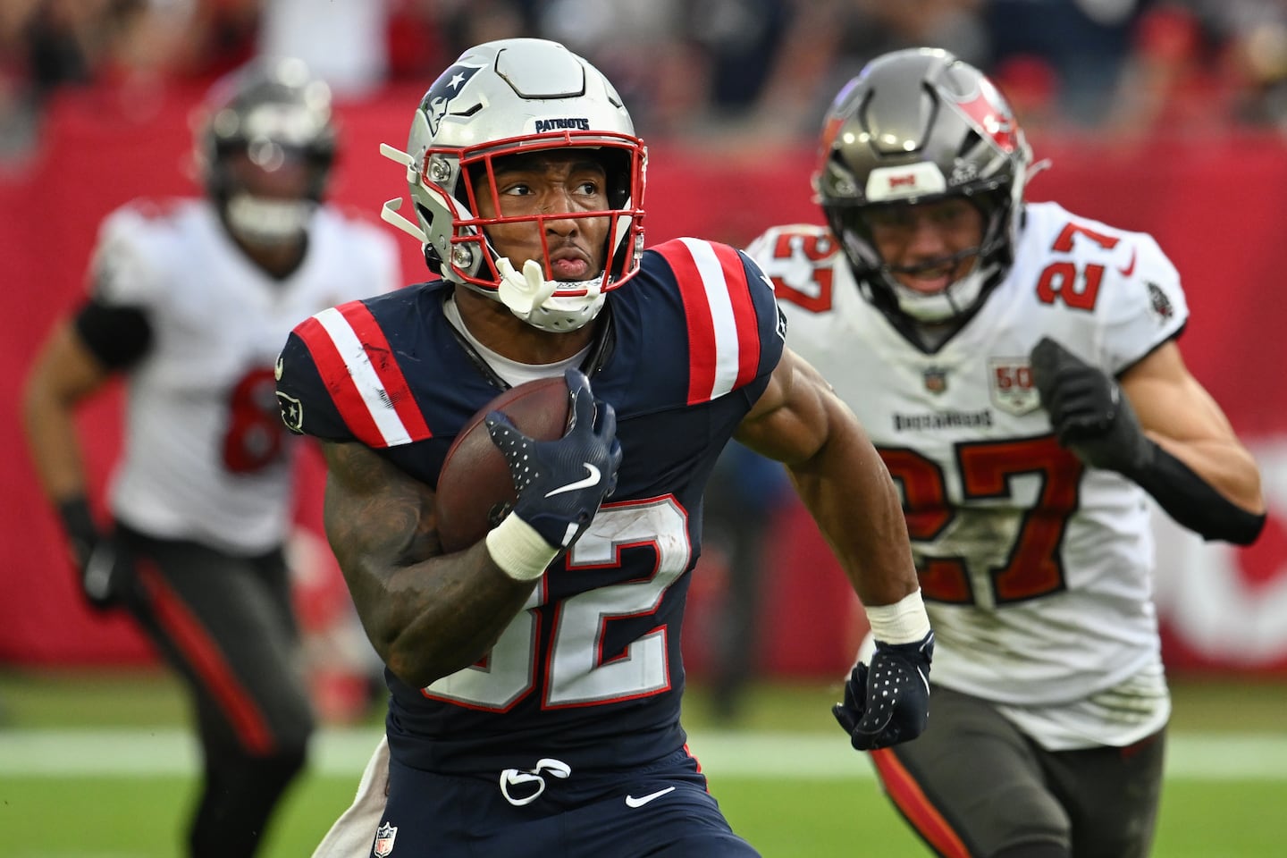 New England Patriots running back TreVeyon Henderson (32) runs for a touchdown against the Tampa Bay Buccaneers during the second half of the November 9 game in Tampa, Florida. 