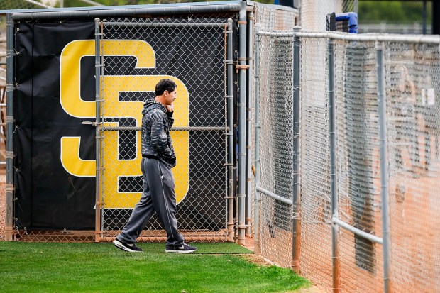 AJ Preller, San Diego Padres president of baseball operations, talks on the phone during spring training workouts at the Peoria Sports Complex on Monday, Feb. 16, 2026 in Peoria, Ariz.(Meg McLaughlin / The San Diego Union-Tribune)