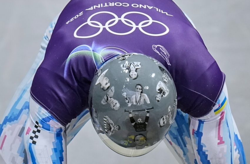  Ukrainian trains in helmet honoring athletes killed in war, IOC says it’s banned for race