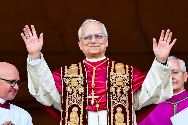 Newly elected Pope Leo XIV, Robert Prevost arrives on the main central loggia balcony of the St Peter's Basilica for the first time in The Vatican, on May 8, 2025.