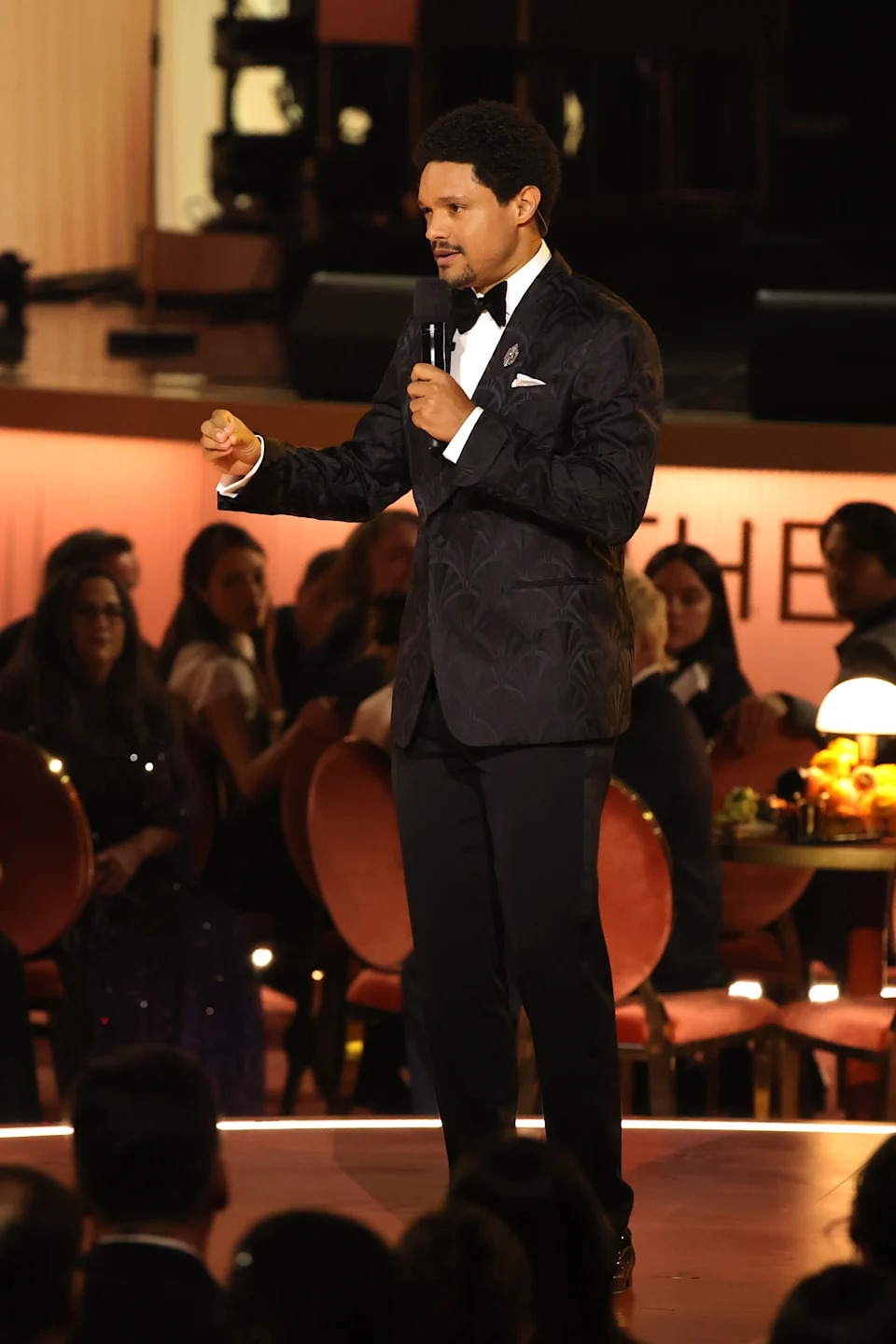 Host Trevor Noah speaks onstage during the Grammys. 