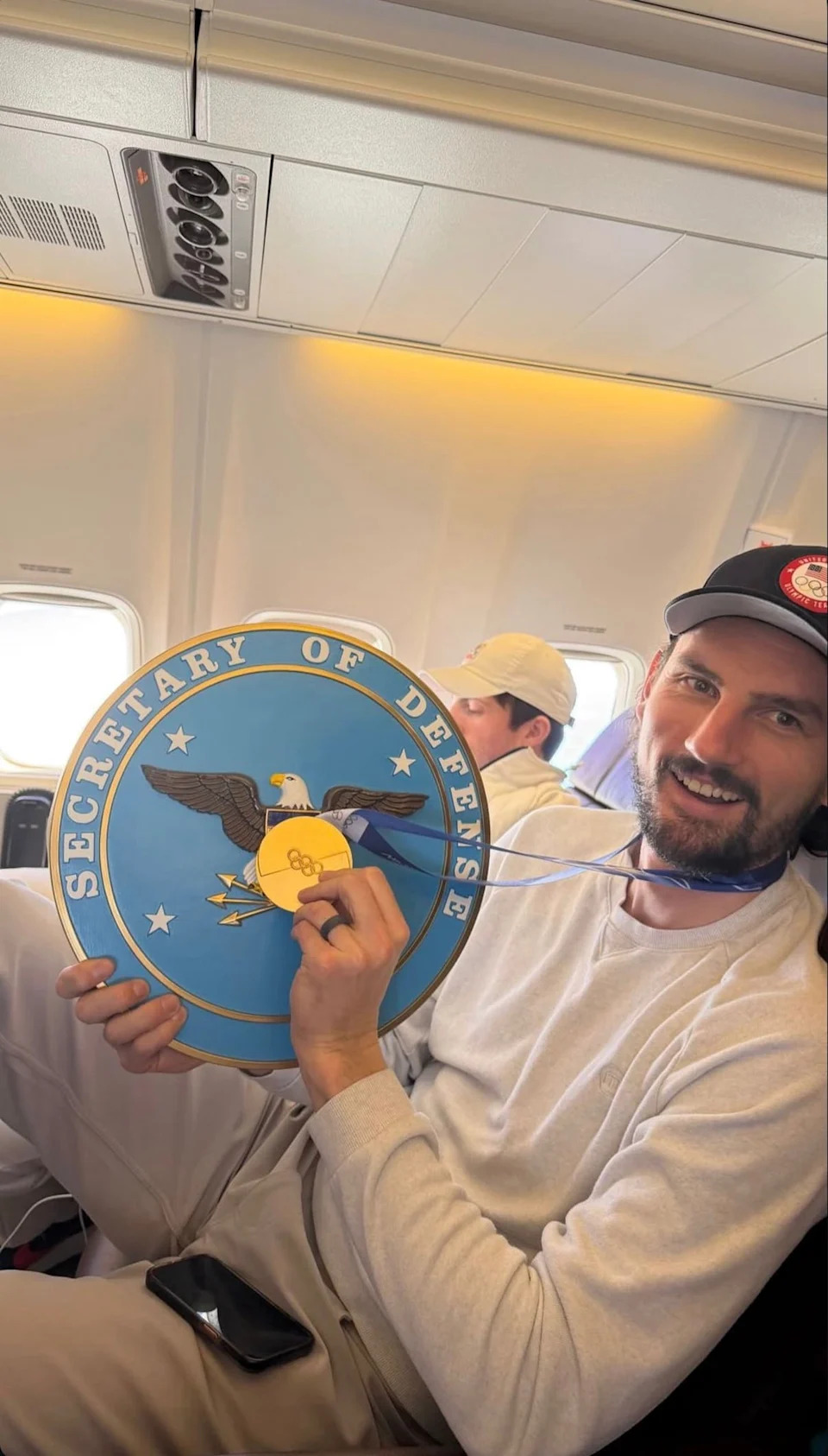 Connor Hellebuyck, team USA's goalie, pictured with a 'secretary of defense' plaque (Department of Defense, X)