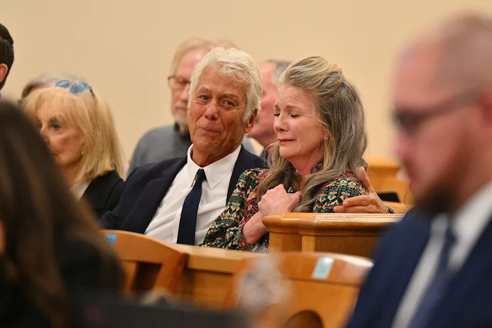Attorney Larry Stein and Melissa Gilbert, wife of director and actor Timothy Busfield, react after a judge granted Busfield a pre-trial release.