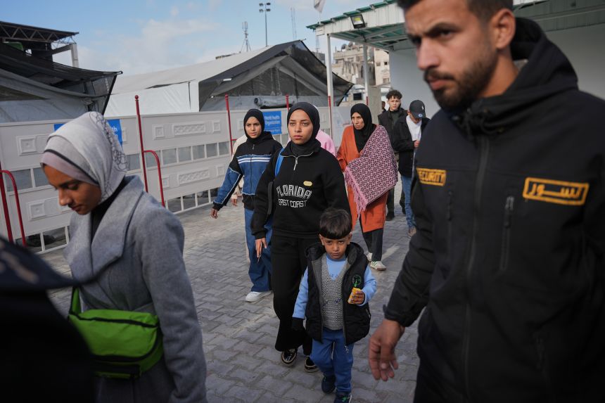 Palestinian patients and their relatives gather to board a bus in Khan Younis in southern Gaza before they head to the Rafah crossing on Wednesday.