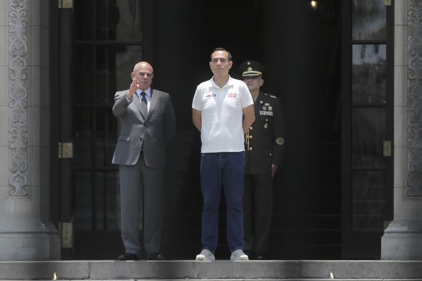 Peru's President Jose Jeri, right, with Prime Minister Ernesto Alvarez during the changing of the guard ceremony at the government palace in Lima, Peru, Feb. 17.