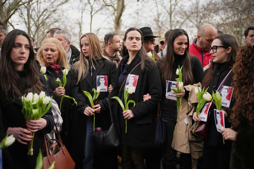 Alice Cordier, third from left, president of French far-right group Collectif Némésis, takes part in a march in Lyon, France, on Saturday to honor Deranque.