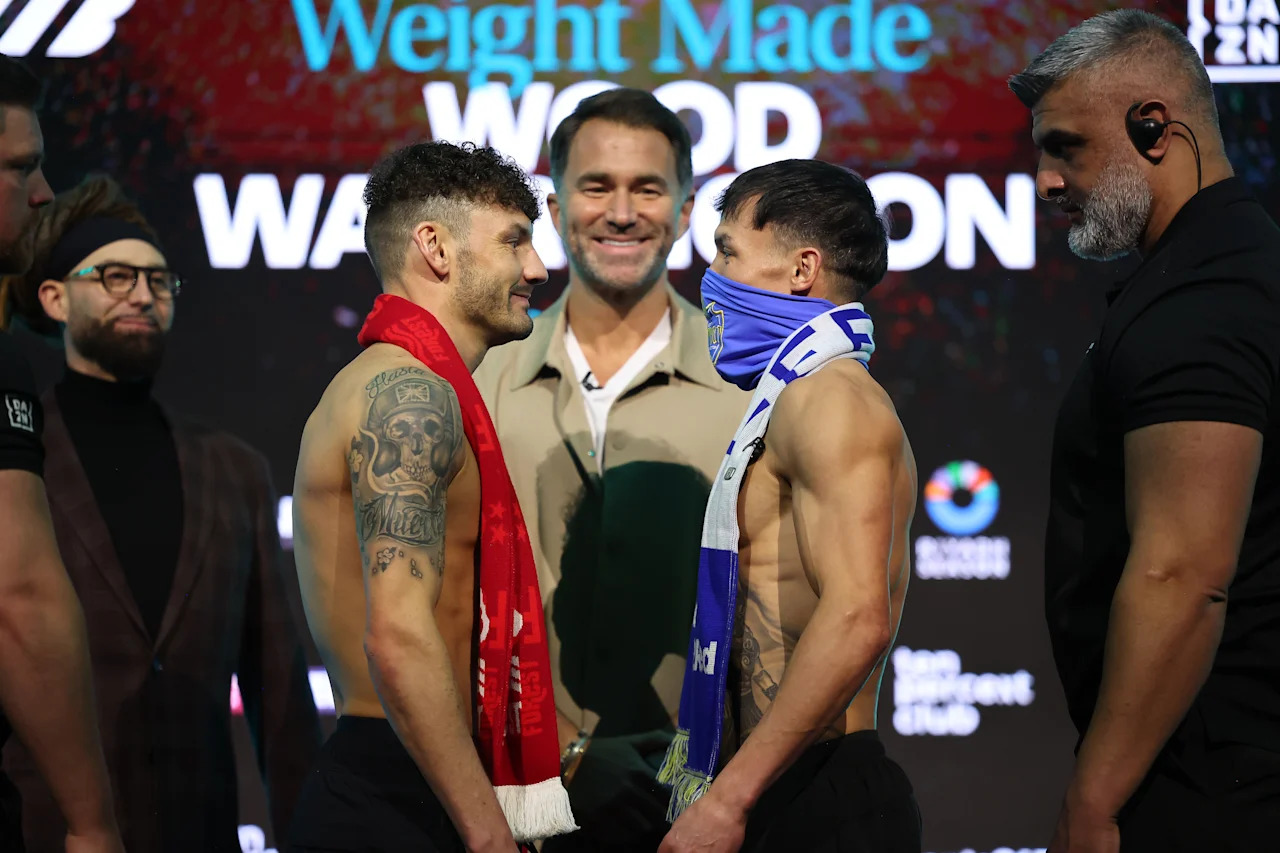 NOTTINGHAM, ENGLAND - FEBRUARY 20: Leigh Wood (left, red scarf) and Josh Warrington Weigh In ahead of their Super Featherweight Contest tomorrow night on February 20, 2026 in Nottingham, England. (Photo by Mark Robinson/Getty Images).