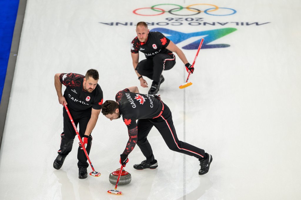 Ben Hebert, Brad Jacobs, and Brett Gallant of Canada competing in a curling match.