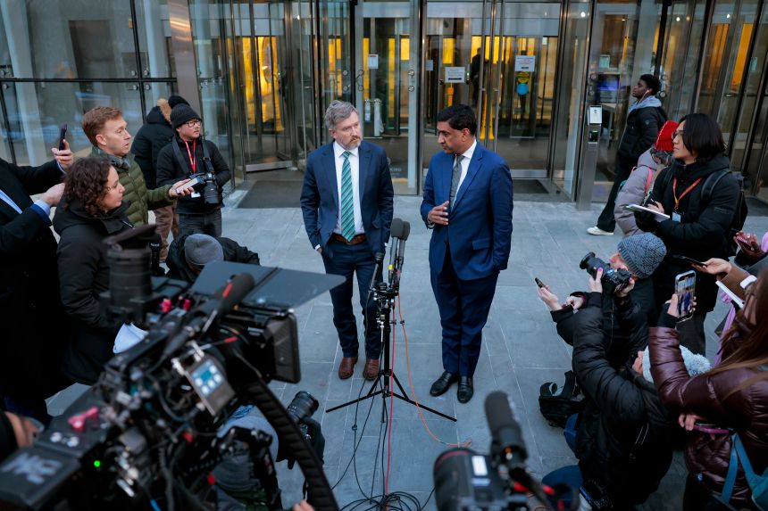Rep. Ro Khanna (right) and Rep. Thomas Massie speak to reporters about the Epstein files outside the offices of the Department of Justice on Monday in Washington, DC.