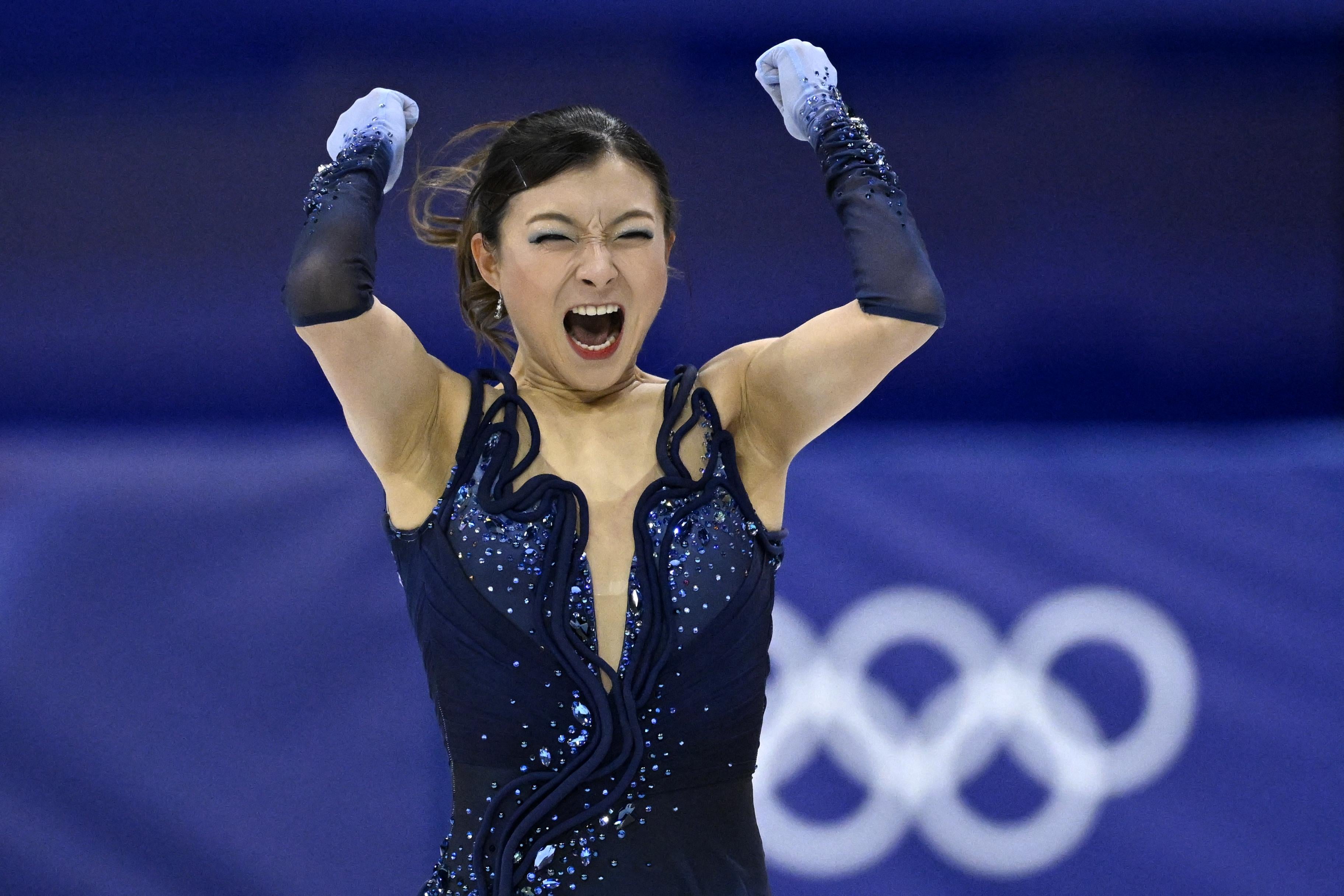 TOPSHOT - Japan's Kaori Sakamoto reacts after competing in the figure skating women's single skating short program during the Milano Cortina 2026 Winter Olympic Games at Milano Ice Skating Arena in Milan on February 17, 2026. (Photo by WANG Zhao / AFP via Getty Images)