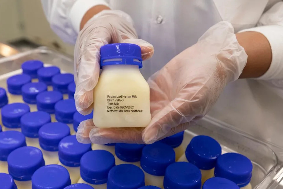 Some women donate milk to milk banks, where it is tested and pasteurized before getting distributed. (Pictured: container of breast milk at Mothers’ Milk Bank of the Northeast) AP