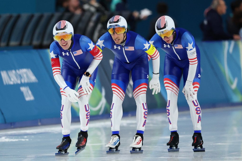 Casey Dawson, Emery Lehman and Ethan Cepuran of Team United States react after taking silver in men's speedskating pursuit at the Winter Olympics on Feb. 17, 2026.
