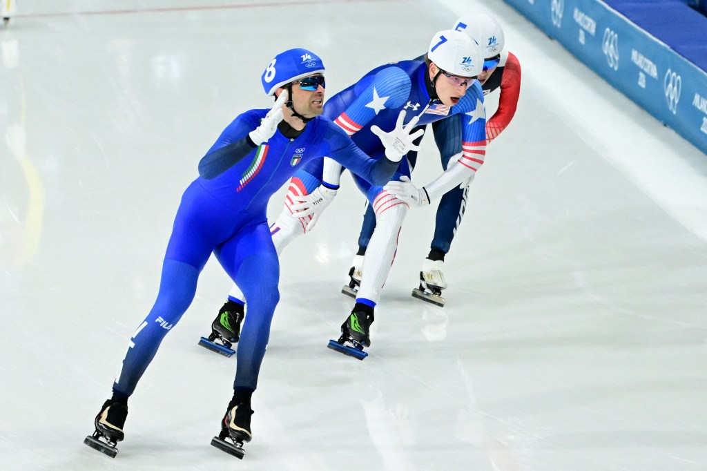 Italy's Andrea Giovannini and USA's Jordan Stolz competing in the speed skating men's mass start final.