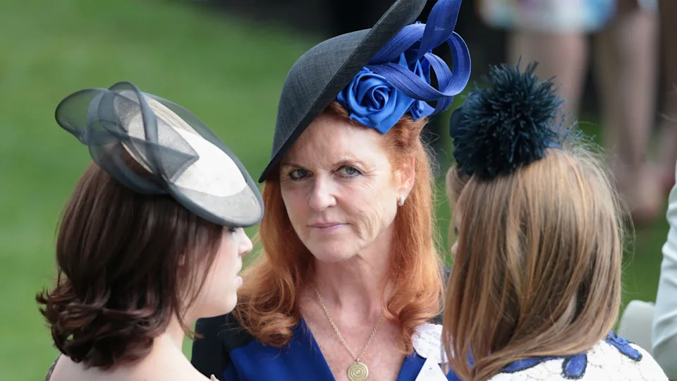 Sarah Ferguson looks at her daughters, Eugenie and Beatrice, at Royal Ascot on June 19, 2015