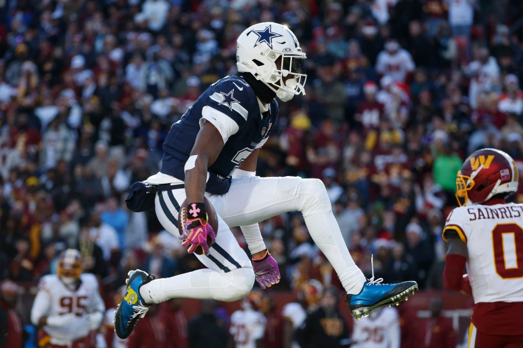 Dallas Cowboys wide receiver George Pickens (3) celebrates after a play against the Washington Commanders.