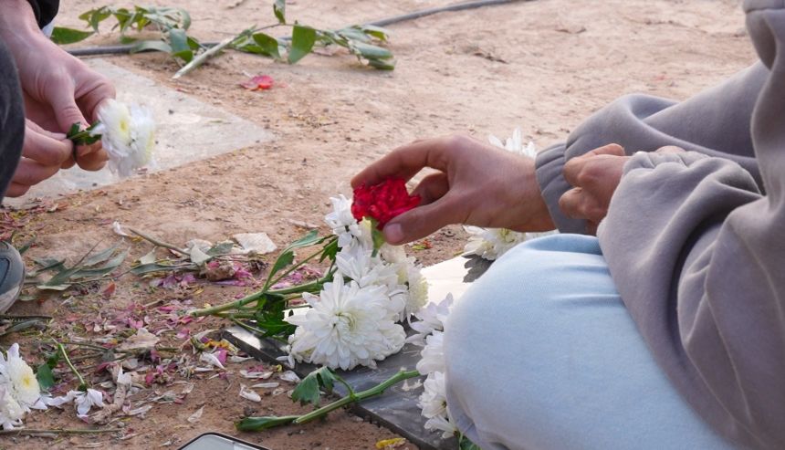 Flowers and petals are laid on graves in the Behesht-e Zahra cemetery, on January 29, 2026.
