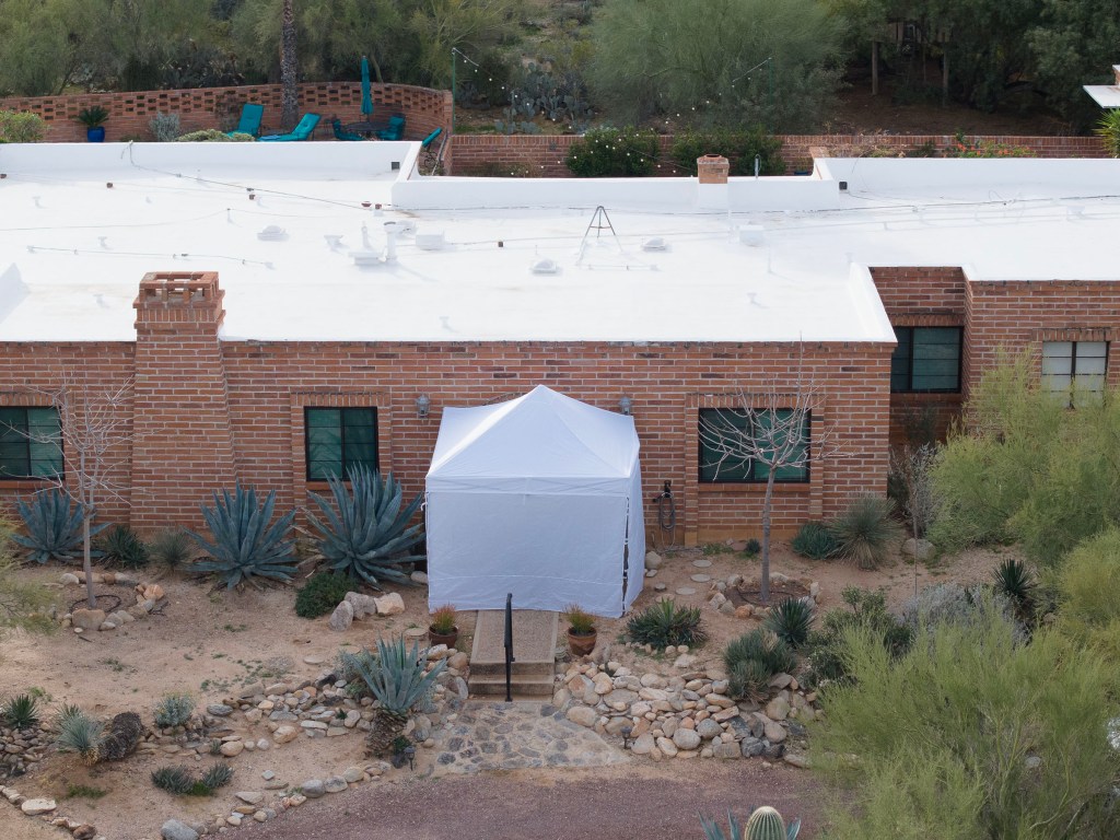 A white tent erected outside Nancy Guthrie's home in Tucson, AZ.