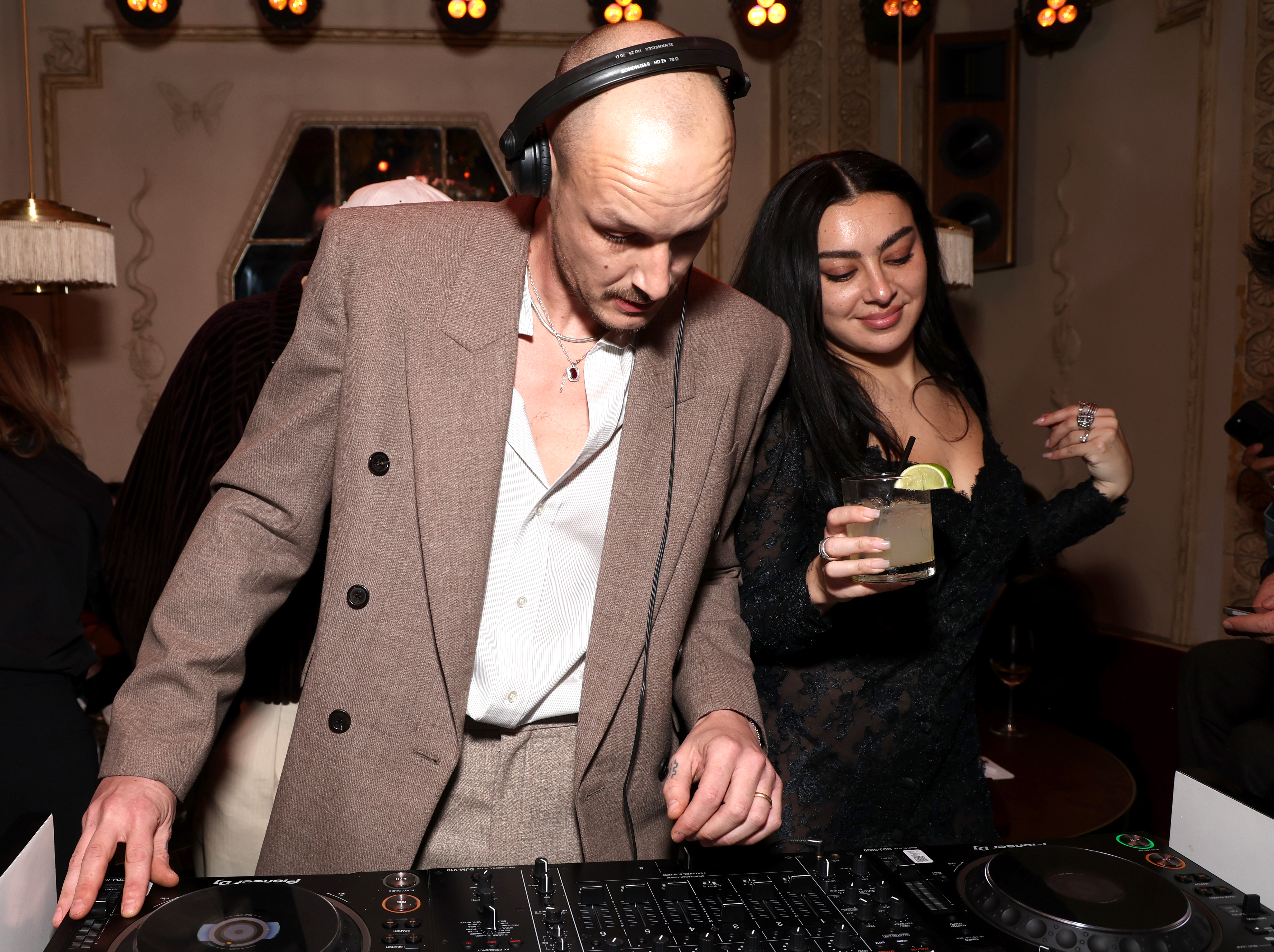 George Daniel and Charli XCX DJ at the W Magazine, Charli XCX, and Saint Laurent Grammy after party at Bar Marmont in Los Angeles.