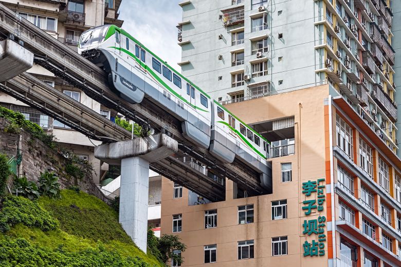 Chongqing Rail Transit Line 2 passes through Liziba Station, where the track runs directly through a residential building.