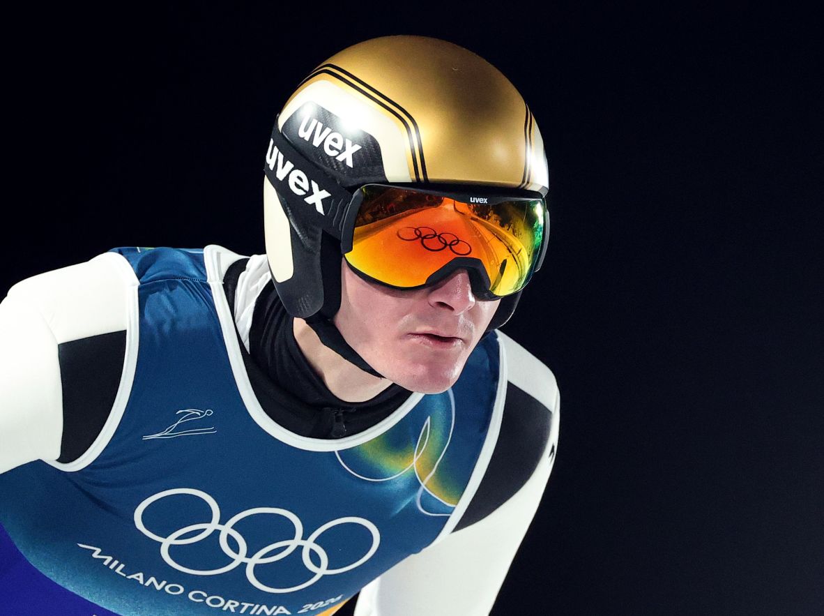 The Olympic rings are reflected in the goggles of Slovenian ski jumper Domen Prevc on February 10.