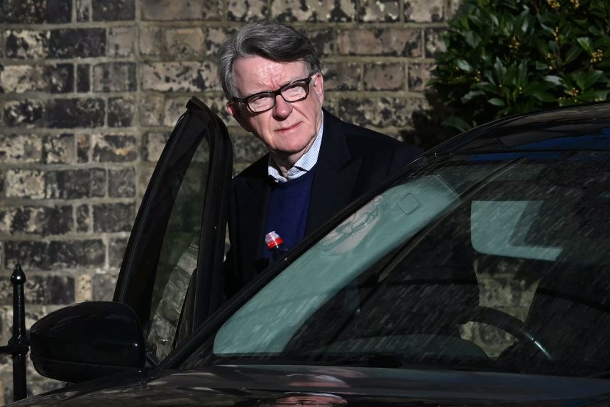 Former UK ambassador to the United States Peter Mandelson gets into a car outside his central London home on Saturday.