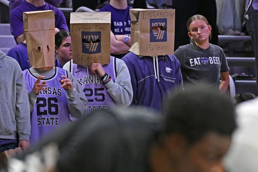 Kansas State Wildcats fans wear paper bags over their heads during a game against the Cincinnati Bearcats on February 11.