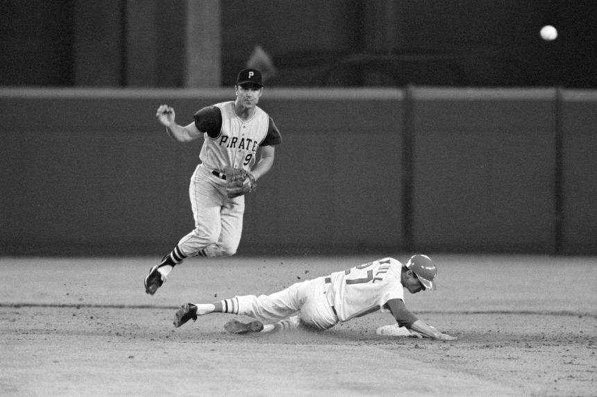 Pittsburgh's Bill Mazeroski forces out Dal Maxvill at second and throws to first for a double play on April 8, 1969.