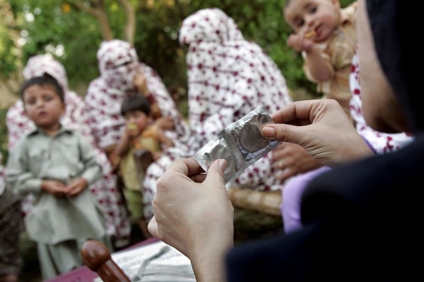 Condoms are shown during a safe sex education class in Swabi district, western Pakistan. One women's rights activist called for greater access to sexual health education.
