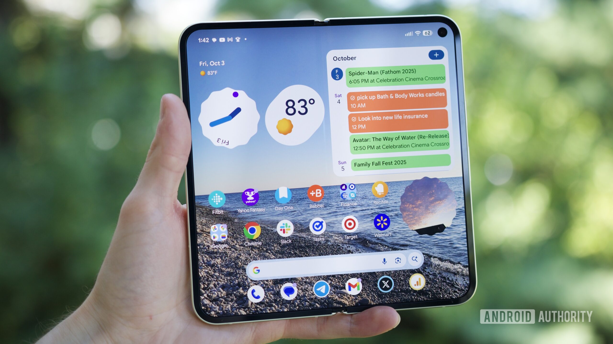 Someone holding the Google Pixel 10 Pro Fold with its inner screen open and turned on.