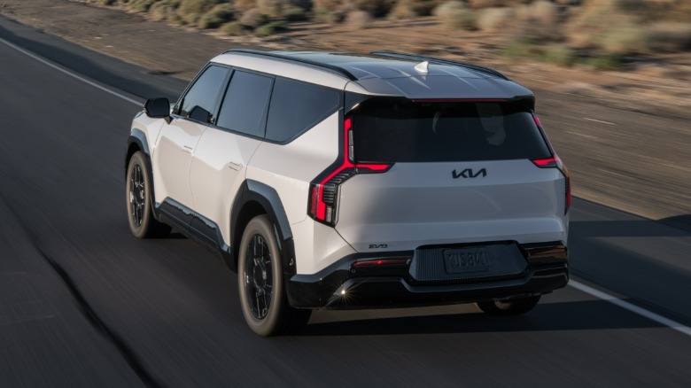 Rear 3/4 view of a white Kia EV9