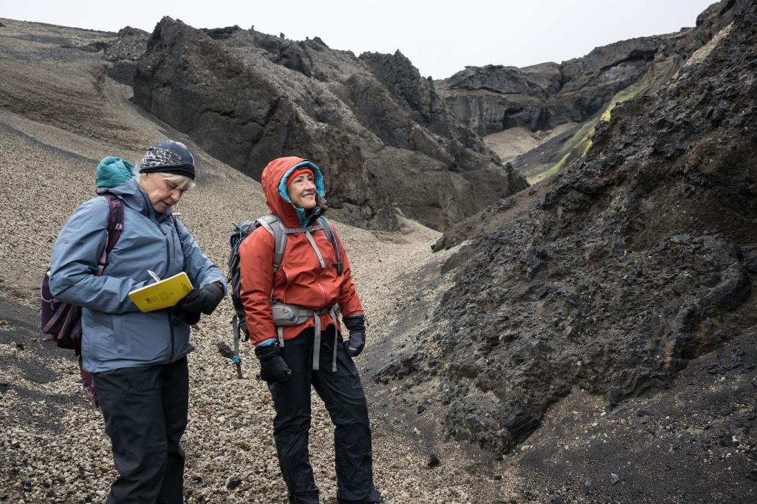 NASA's Artemis geology training lead Cindy Evans (left) and Artemis II astronaut Christina Koch study moon-like geologic features in Iceland