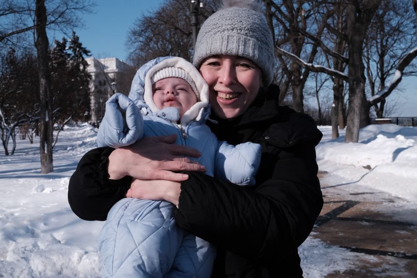 Olena Bilozerska takes her baby son Pavlo on a walk in Kyiv.